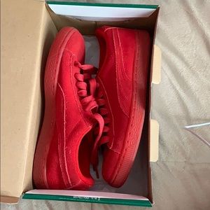 Red suede Pumas